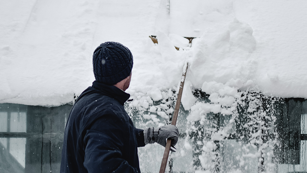 How do you use a roof rake?